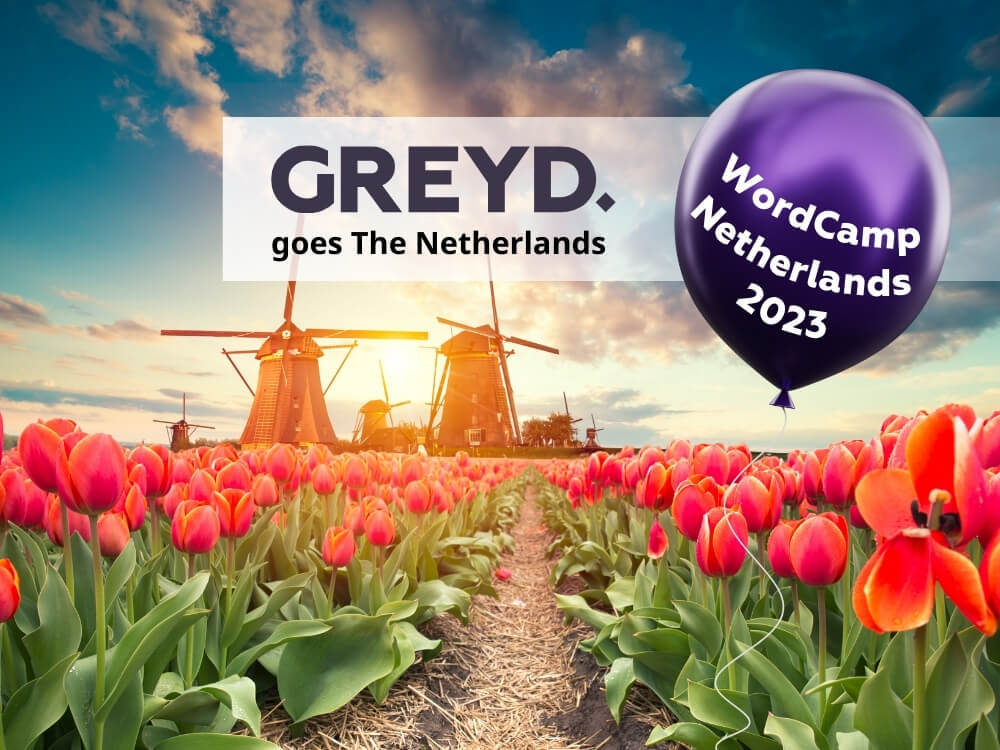 Red Tulip field with Dutch wind mills. Caption: "Greyd goes the Netherlands" WordCamp Netherlands 2023.